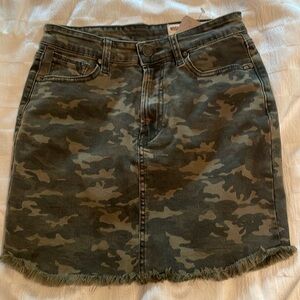 Never worn. New with tag from boutique camo Jean skirt